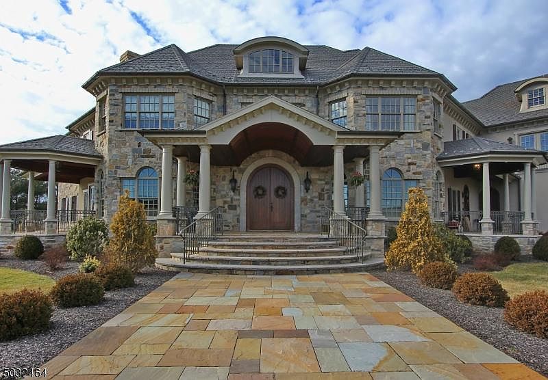 Stunning luxury stone estate in Hillsborough, NJ, representing the premium real estate market for 2026 home buyers.
